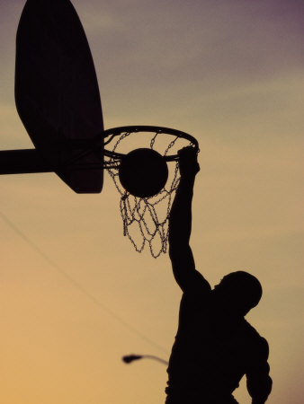 Silhouette of a Man Slam Dunking a Basketball Poster
