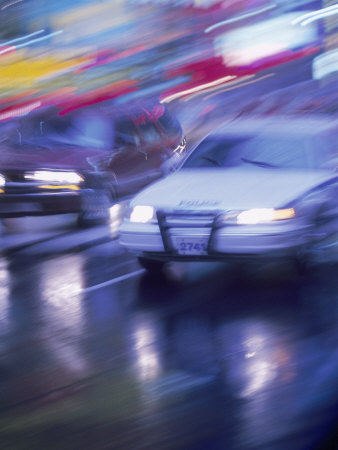 Police Car and Car on Wet Street, NYC