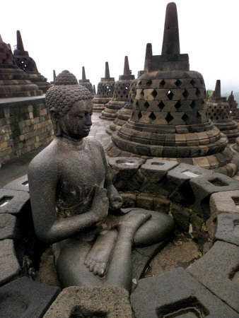 A Statue of Buddha Sits on a Terrace