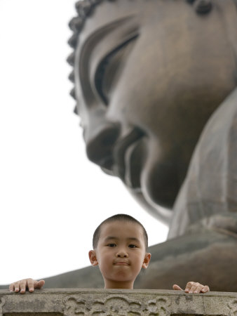 Young Boy in Front of Giant Buddha at Ngong Ping Plateau, China