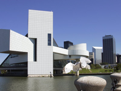 A Ring-Billed Gull Takes Flight in Front of the Rock and Roll Hall of Fame and Museum