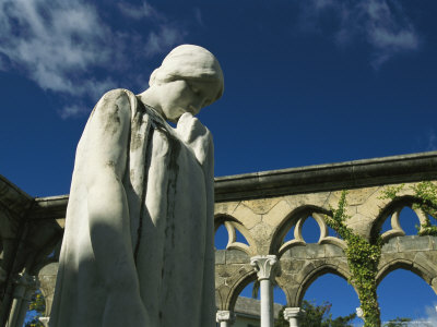 Buy A Marble Statue in a Courtyard Surrounded by Arched Walls at AllPosters.com