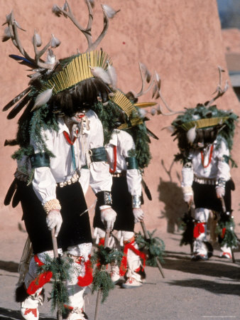 Native American Men Perform a Deer Dance in Costume