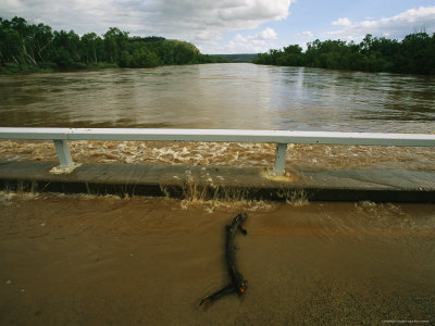 Flood Waters Rise to Meet a Bridge on the Victoria River