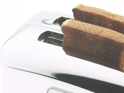 Toast Popping out of Sleek Stainless Steel Toaster