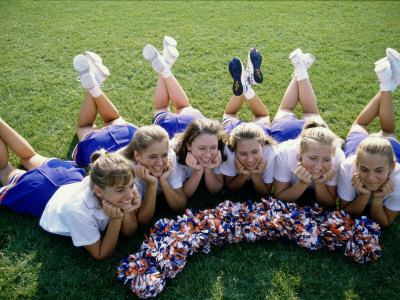 High Angle View of Cheerleaders Lying on a Lawn Poster