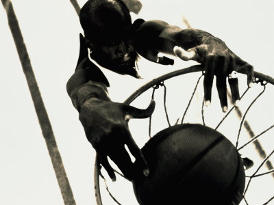 High Angle View of a Basketball Player Slam Dunking a Basketball Poster