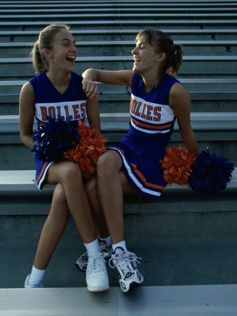 Two Cheerleaders Sitting with Pom-Poms Poster