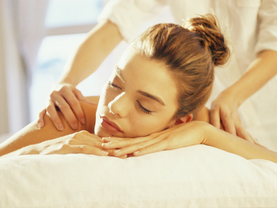 Close-up of a Young Woman Getting a Back Massage