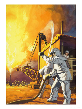 Fireman in Safety Suit Fighting a Fire at an Oil Field
