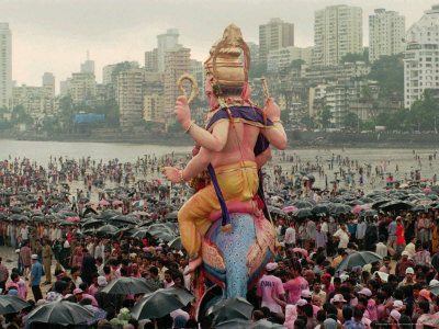 A Crowd of Revellers Carry a Statue of Ganesh