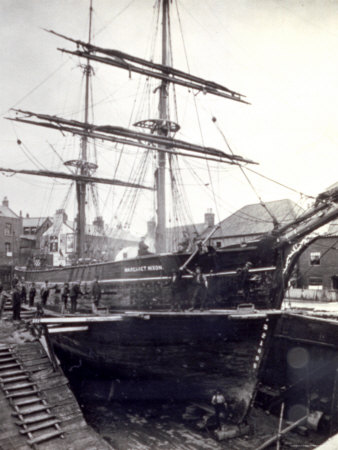 Sailing ship in a dockyard.