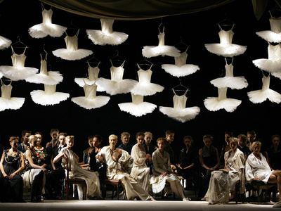 Models Sit on the Stage at the End of the Antonio Marras Fashion Collection