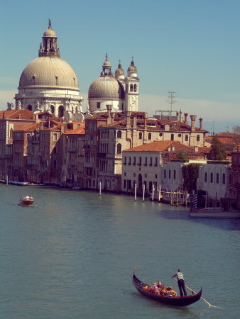 Gondola on the Grand Canal nearing the Santa Maria della Salute, Venice, Italy