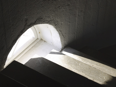 Dark Stone Steps with an Illuminated Archwed Window