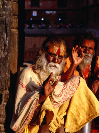 Portrait of Two Sadhus Making Hand Signals in Taumadhi Square, Bhaktapur, Nepal