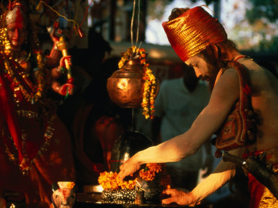 Sadhu Making Puja at Maha Devi Shrine Brings Offerings During Kumbh Mela, Haridwar, India
