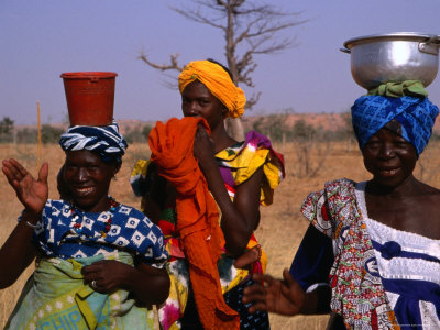 Buy Colourfully Attired Local Women Collecting Water in the Mopti Region, Mali at AllPosters.com