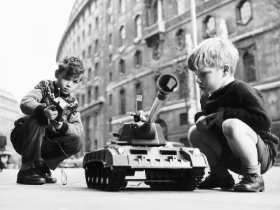 Two Boys Playing with a Remote Controlled Tank