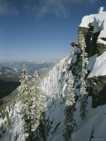 Buy Man Rappels Down Red Mountain with a Snowboard on His Back at AllPosters.com
