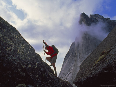 Climber Scales a Boulder Below Mount Harrison Smith