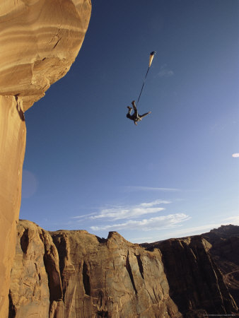 Buy Base Jumper Leaping with a Parachute From the Tombstone Formation at AllPosters.com