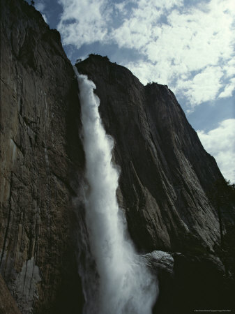 Cascading Waterfall Pours Down From High Above
