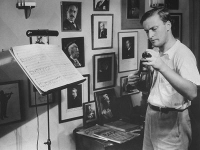 Violinist Yehudi Menuhin, 20, Tuning His Violin, Prepares to Practice the Schumann Violin Concerto