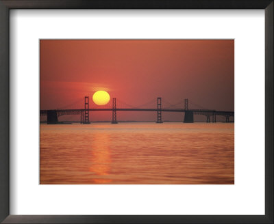 View from the water of the Chesapeake Bay Bridge and the setting sun