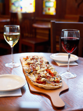 Delicious Italian Pizza and Wine on Table