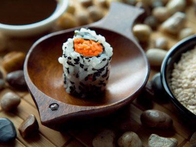 Traditional Sushi Roll in Wooden Dish