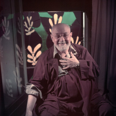 Portrait of Artist Henri Matisse at Home in Nice with Stained Glass Panels in Background