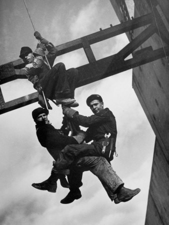 Buy Relief Workers Hanging from Cable in Front of a Giant Beam During the Construction of Fort Peck Dam at AllPosters.com