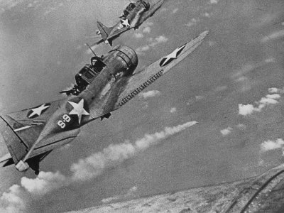 American Navy Torpedo Bombers Fly over Burning Japanese Ship During the Battle of Midway