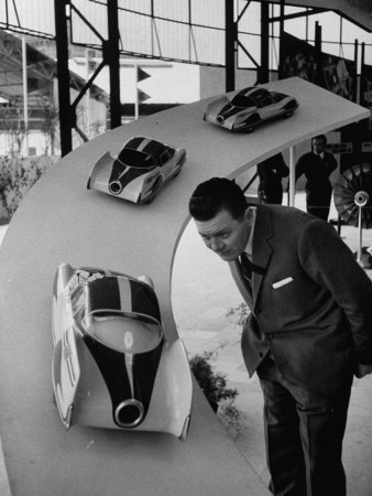 Man Admiring Fiat Automobile Exhibit at the Milan Fair