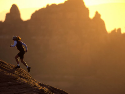 Buy Woman Runs Up a Red Rock Slope, Sedona, Arizona, United States at AllPosters.com