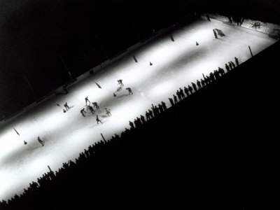View from Above of a Hockey Game on Ice at Night