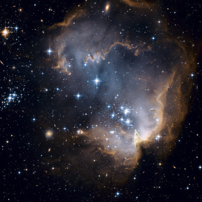 Buy Bright blue newborn stars blast a hole through a nearby dwarf galaxy at AllPosters.com
