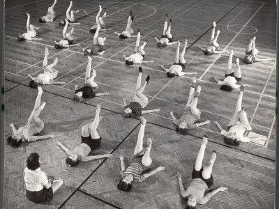 Girls and Women Doing Leg Exercise on Floor of Metropolitan Life Insurance Company's Gym