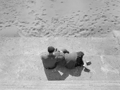 High Angle View of a Senior Couple Sitting on Steps, San Francisco, California, USA