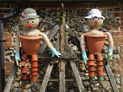 Comical Flowerpot Men Feature in a Country Garden, Norfolk, UK