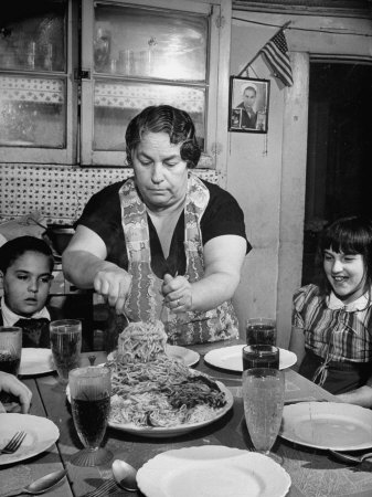 Mother Serving Spaghetti to Her Children