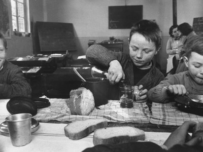 School Children in Classroom Eating Hot Food, Hard Bread, Cider