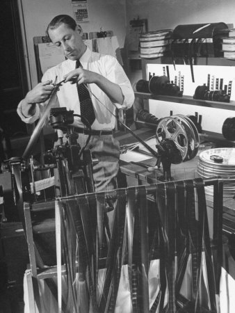 Film Editor Alex Troffey Preparing the Film in a Camera