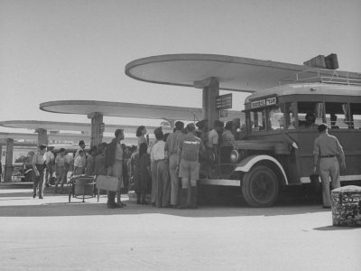 Crowds of People Waiting to Board Buses