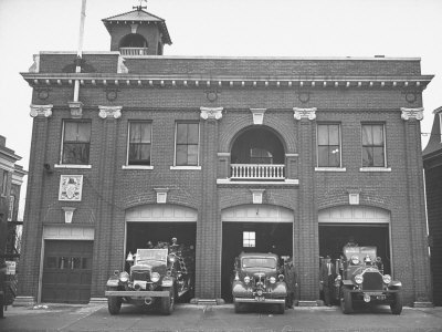Fire Trucks Sitting Ready to Go at a Firehouse
