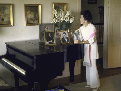 Rose Kennedy Standing by Concert Grand Piano Covered with Family Photos