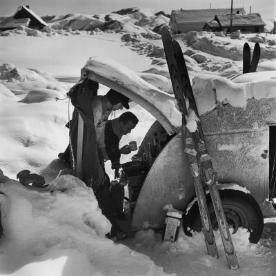 Ski Bum Bob Lombard Pouring Coffee from the Back of His Trailer