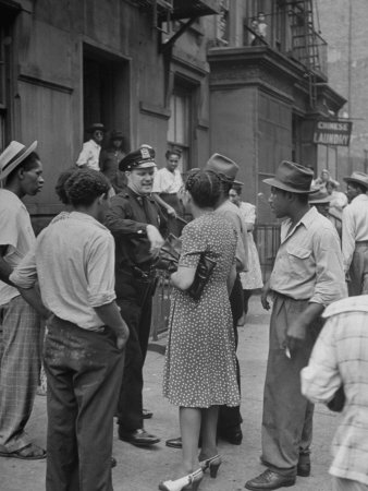 People Gathering around a Police Officer in Harlem