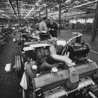 Industrialist J. Irwin Miller Inspecting Turbodiesel Engines with Workers